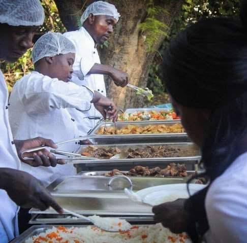 Peshi's Kitchen Catering logo